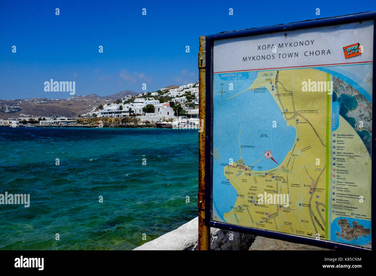 General views of Mykonos, Greece including buildings, flags and waterfront on September 56, 2017. Stock Photo