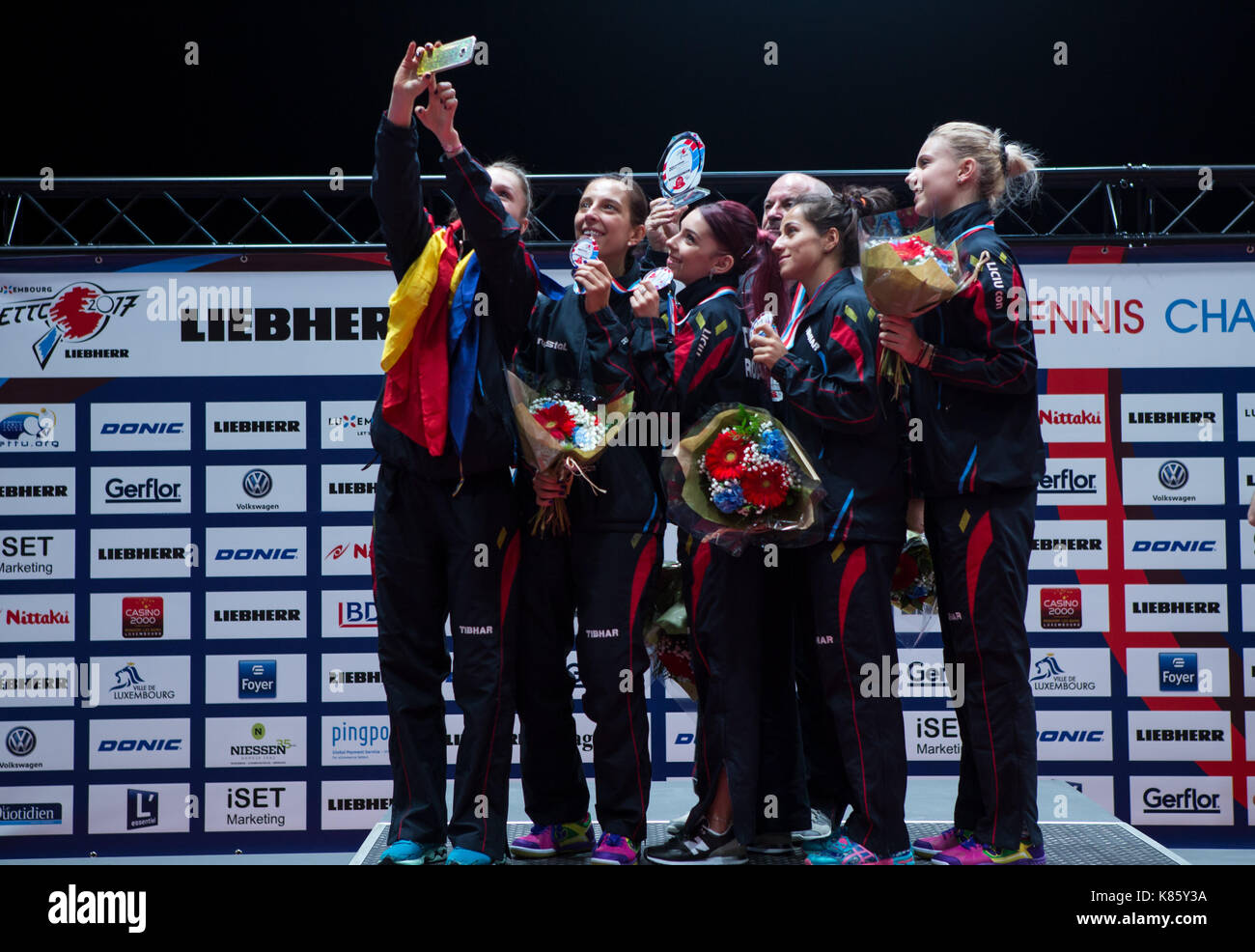 The Romanian women's table tennis team celebrate after their victory