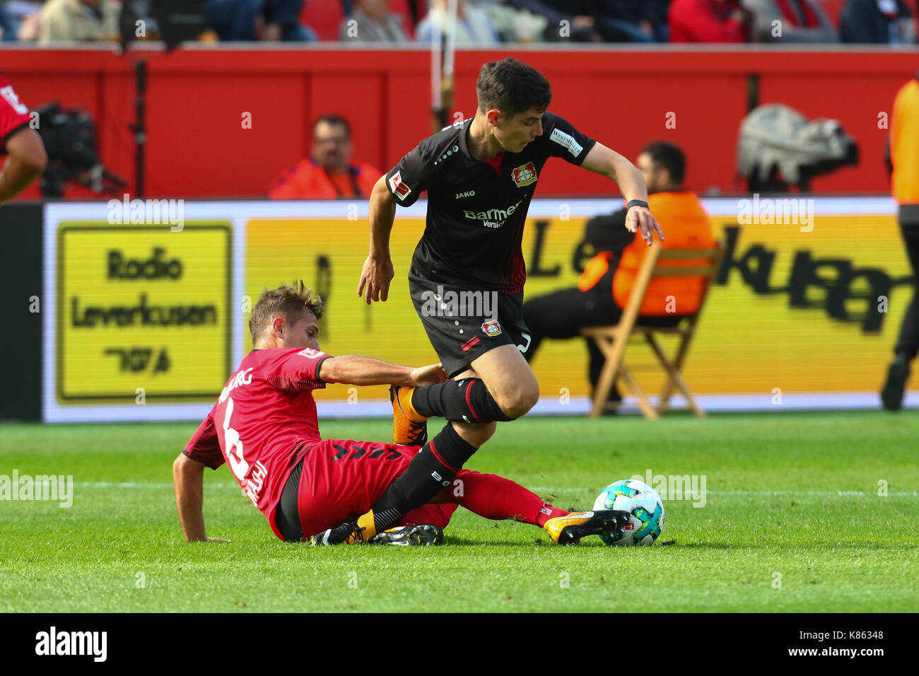 Leverkusen, Germany. 17th Sep, 2017. Leverkusen, Germany September 17, 2017, Bundesliga matchday 4, Bayer 04 Leverkusen vs SC Freiburg: Tackling Kai Havertz ler vs Amir Abrashi (Freiburg). Credit: Juergen Schwarz/Alamy Live News Stock Photo