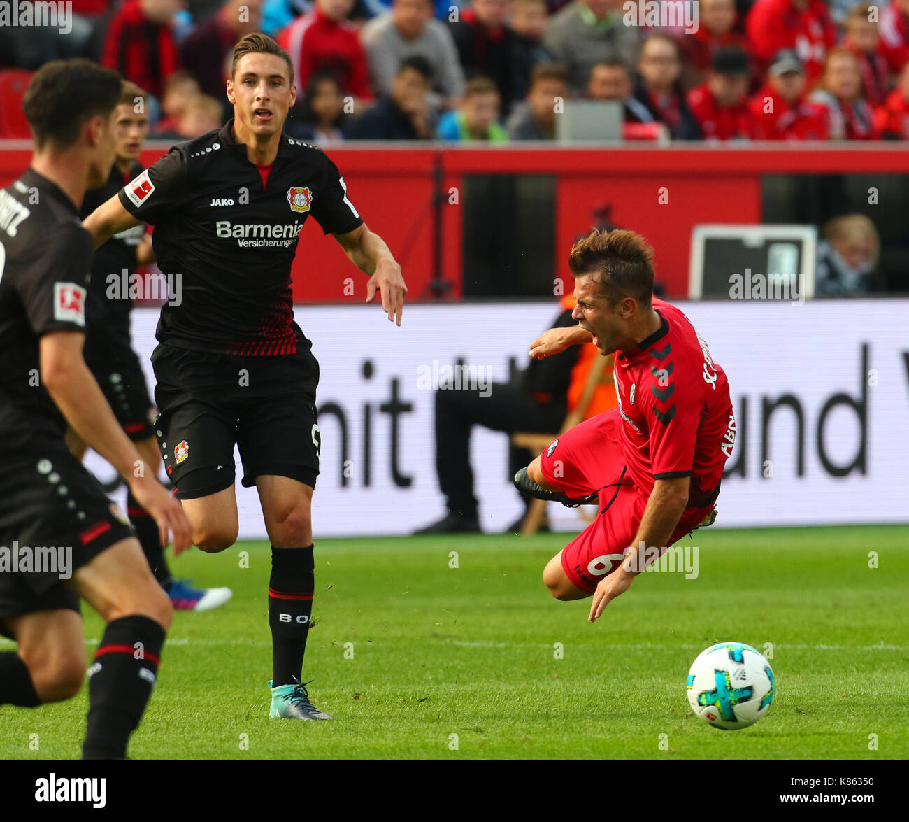 Leverkusen, Germany. 17th Sep, 2017. Leverkusen, Germany September 17, 2017, Bundesliga matchday 4, Bayer 04 Leverkusen vs SC Freiburg: Tackling Dominik Kohr (B04, L) vs Amir Abrashi (Freiburg). Credit: Juergen Schwarz/Alamy Live News Stock Photo