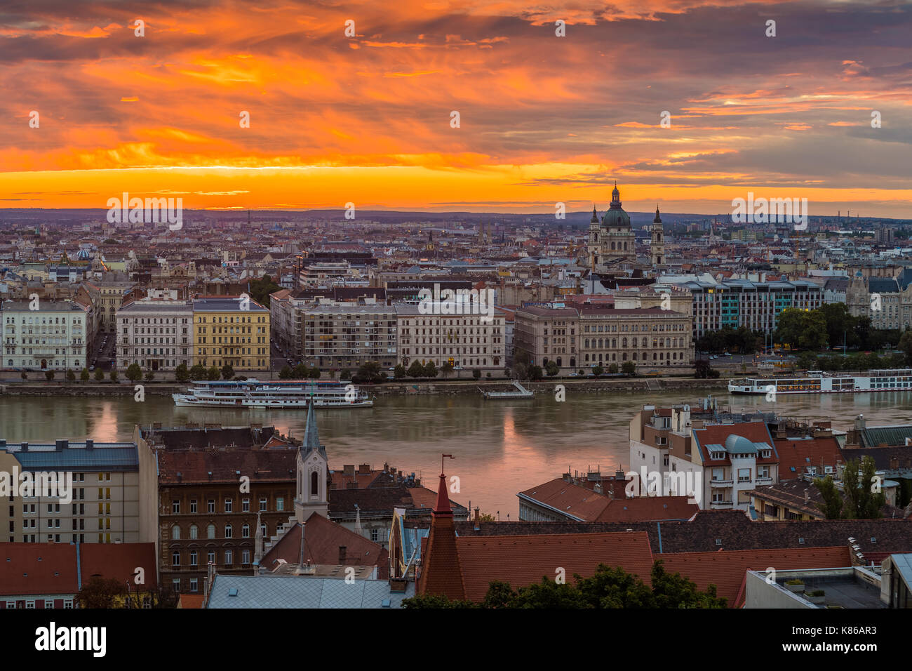 Budapest, Hungary - Panoramic skyline view of Budapest with the Parliament of Hungary and a beautiful golden sunrise taken from Buda Hill Stock Photo