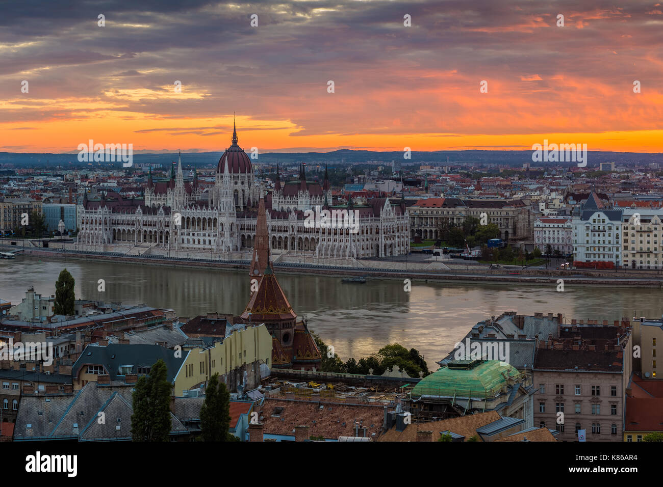 Budapest, Hungary - Panoramic skyline view of Budapest with the Parliament of Hungary and a beautiful golden sunrise taken from Buda Hill Stock Photo