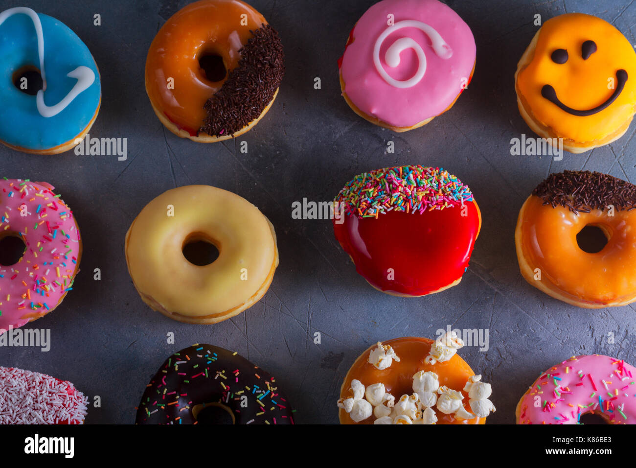 sweet doughnuts on gray stone background Stock Photo
