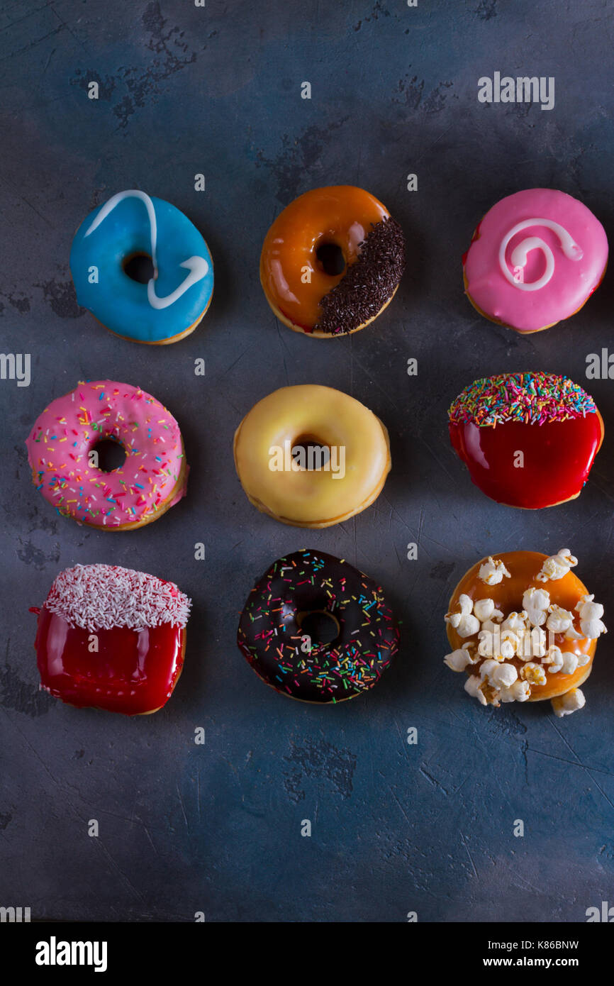 sweet doughnuts on gray stone background Stock Photo