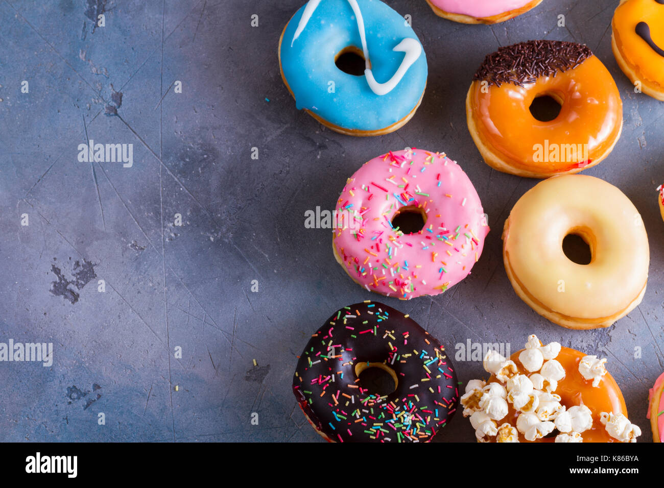 sweet doughnuts on gray stone background Stock Photo