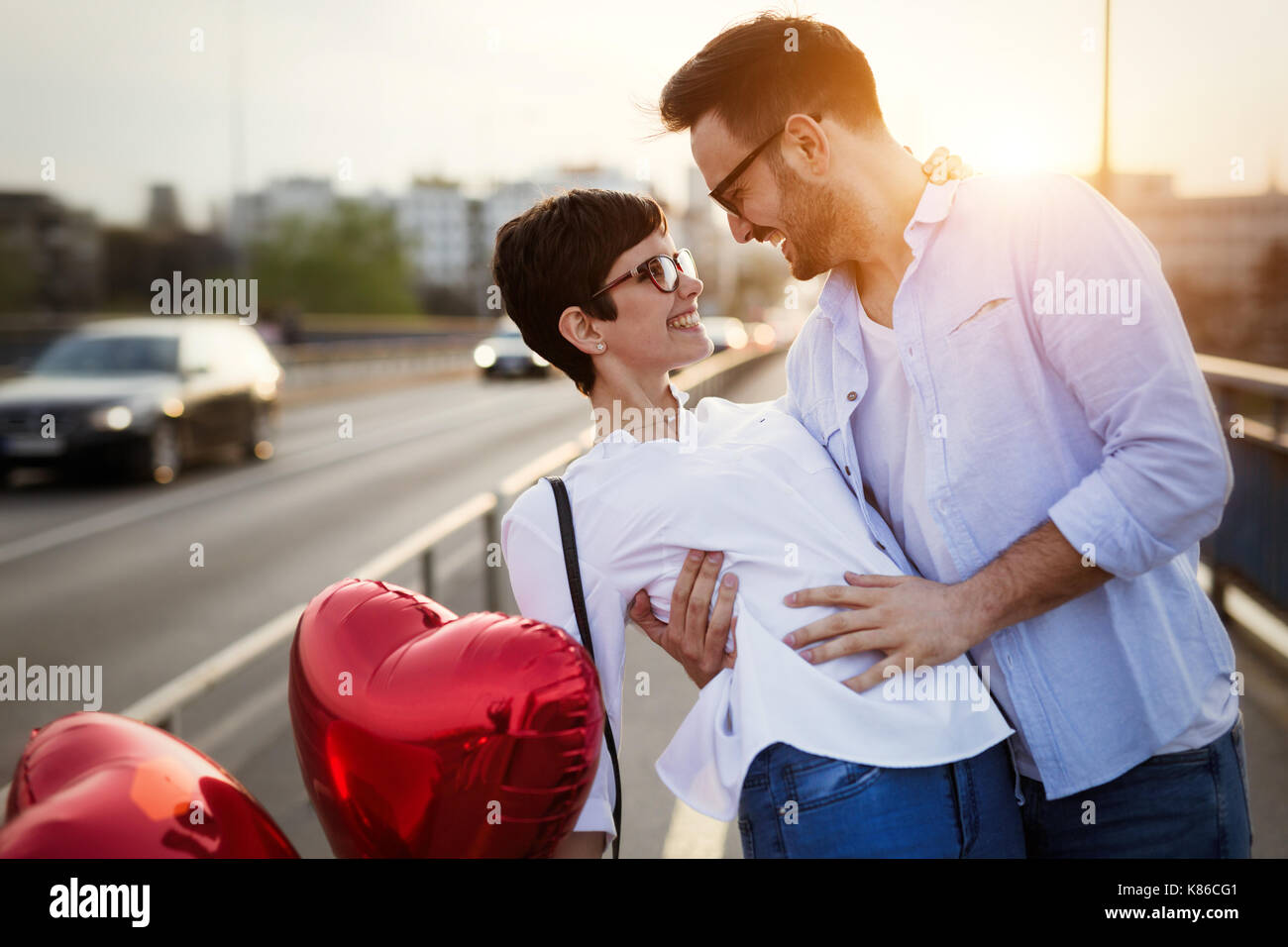 Young couple in love dating and smiling outdoor Stock Photo