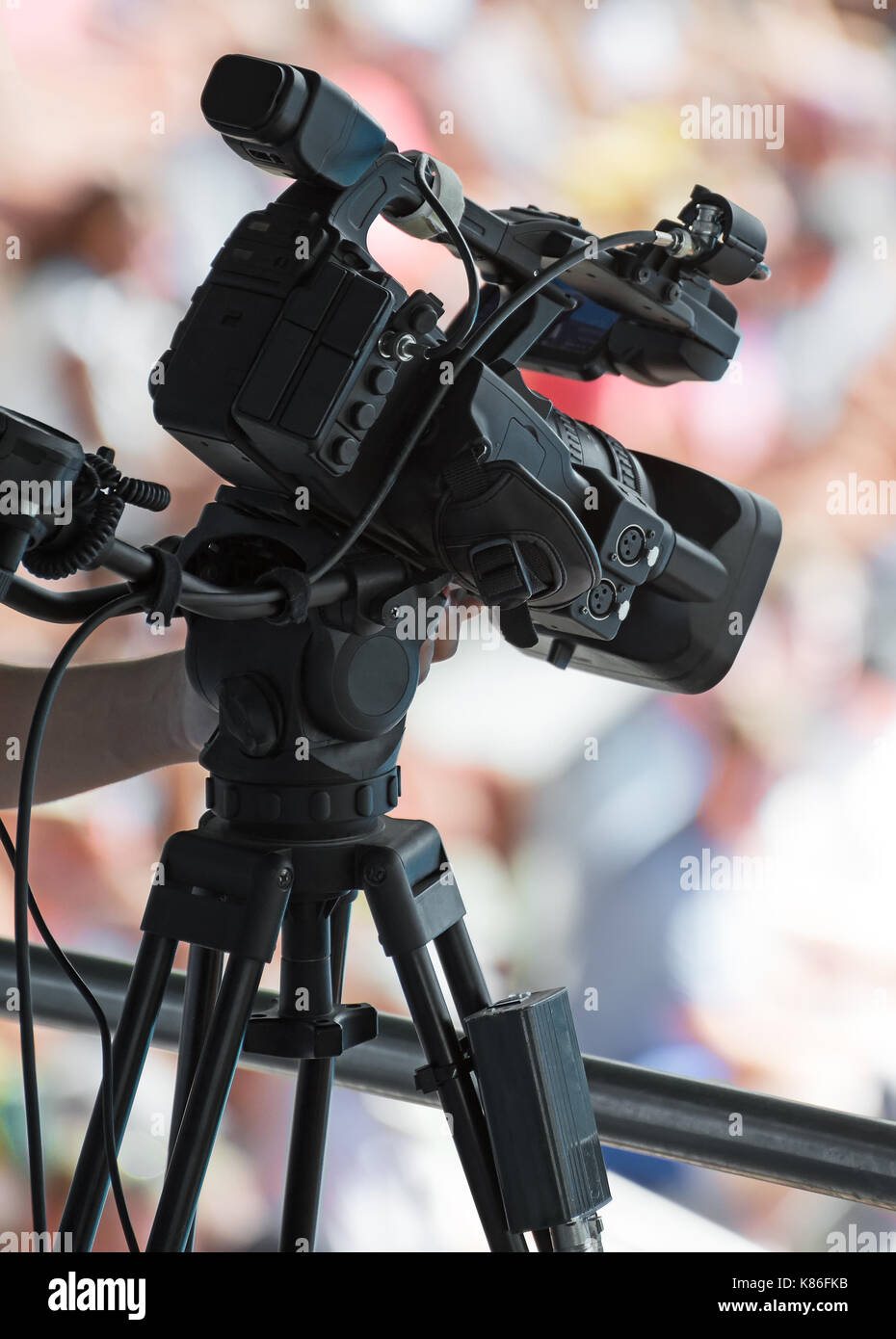 Professional TV camera making a movie of event. Stock Photo