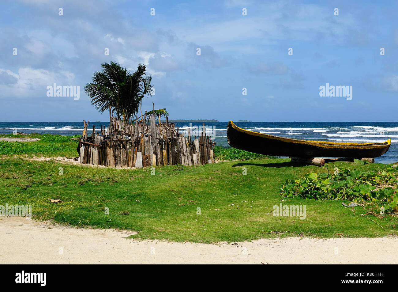 Central America, Panama, Traditional boat Kuna indians and homestead for animals on the San Blas archipelago Stock Photo