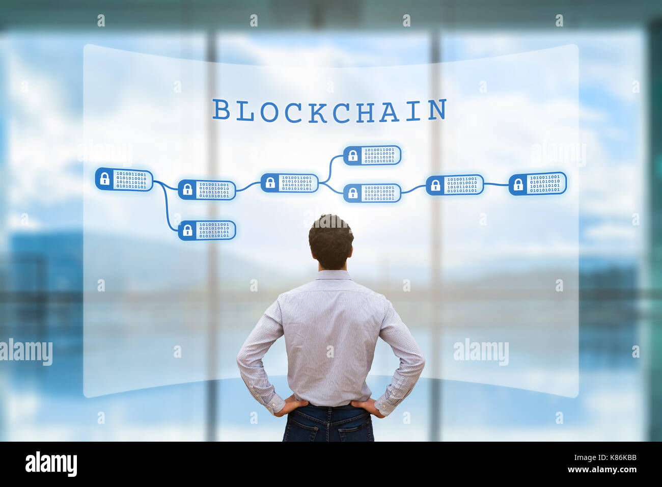 Person looking at blockchain concept on screen as a secured decentralized ledger for cryptocurrency financial technology and business transaction data Stock Photo