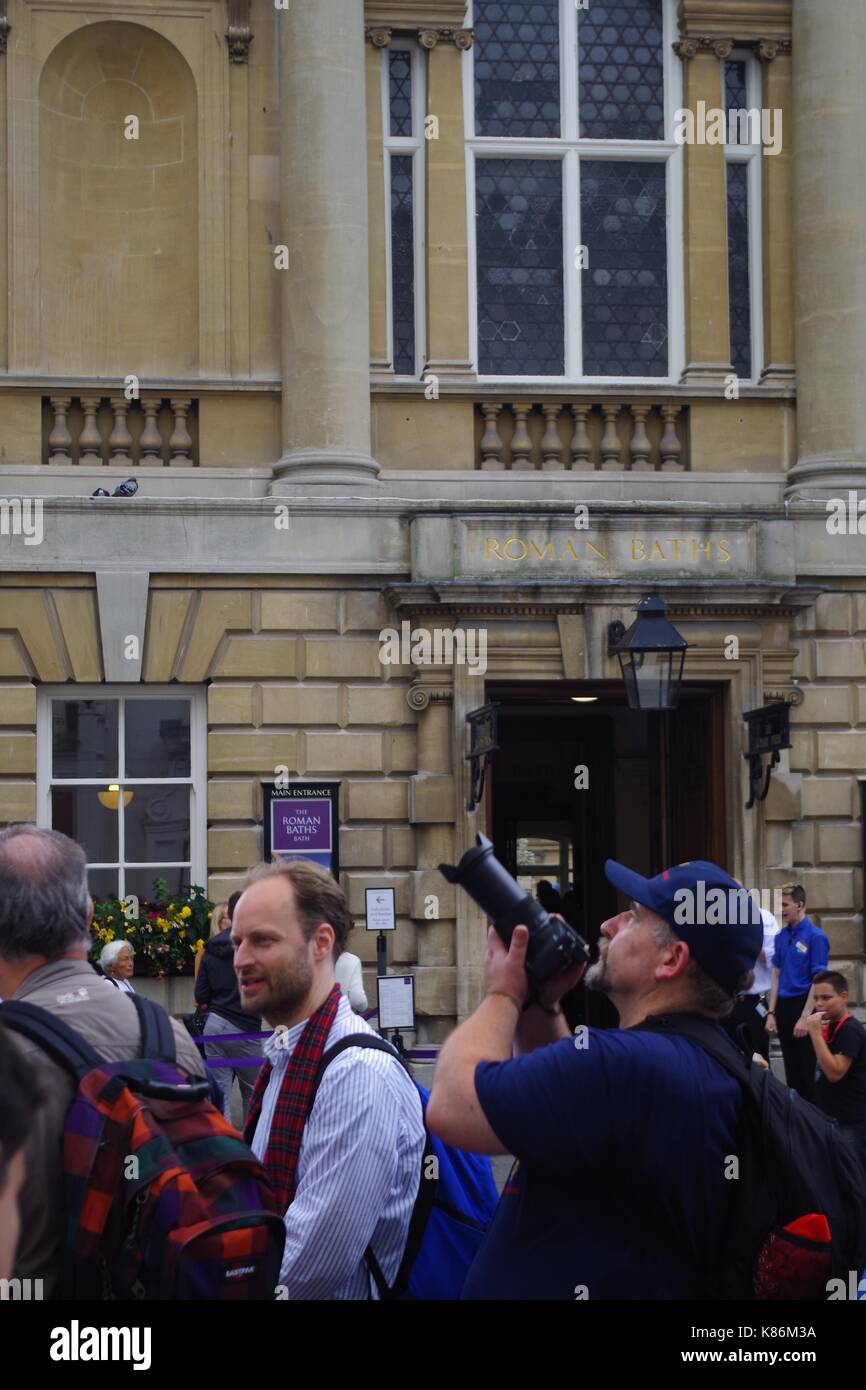 Photographer Tourist Outside the Roman Baths. City of Bath, Somerset, UK. August, 2017. Stock Photo