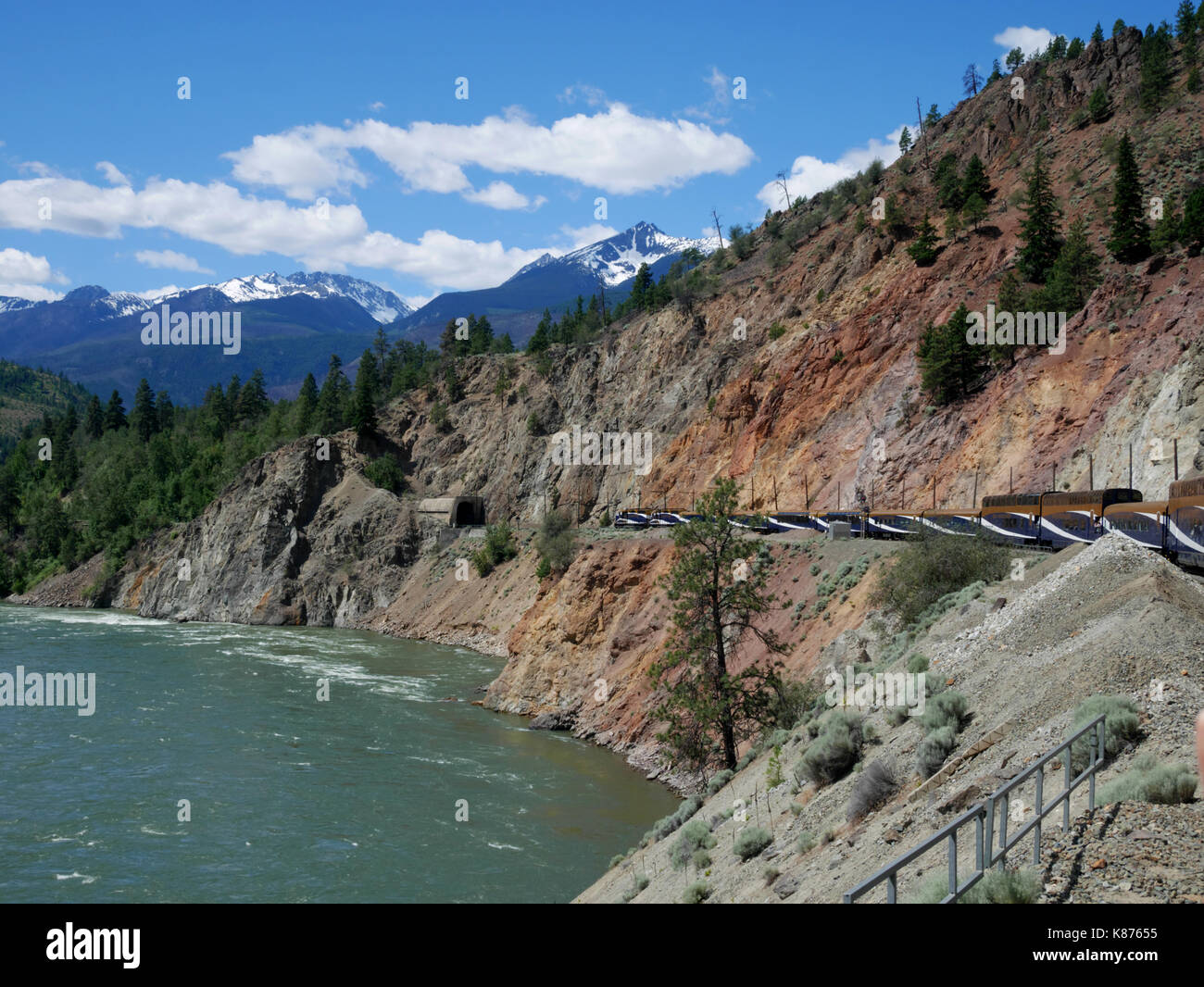 The Rocky Mountaineer passes through Rainbow Canyon beside the Thompson River heading from Kamloops to Vancouver. Stock Photo