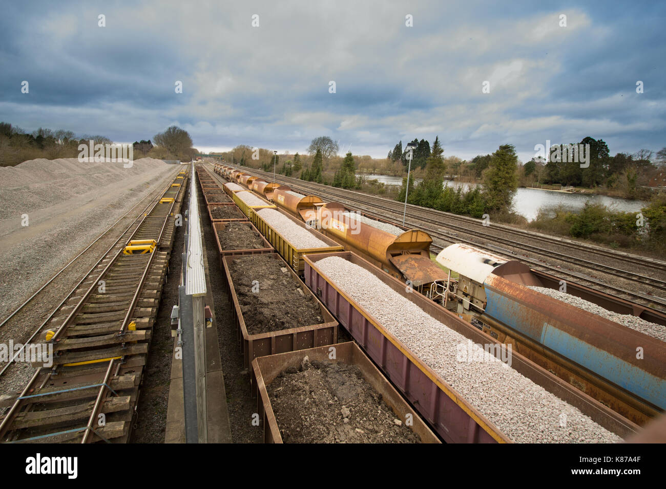 Rail sidings with stationary carriages and dramatic sky Stock Photo