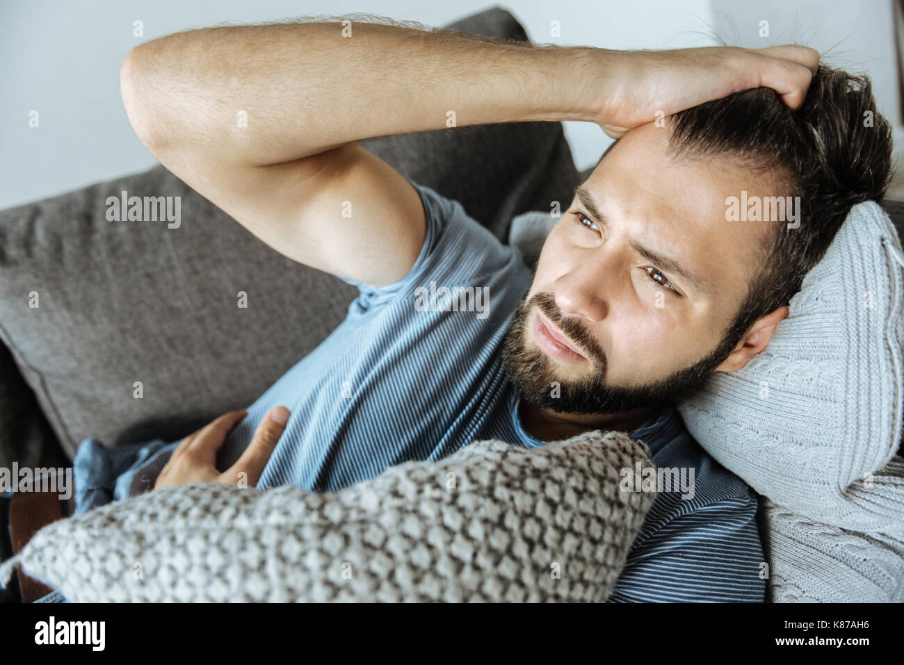 Sad handsome man feeling bad Stock Photo