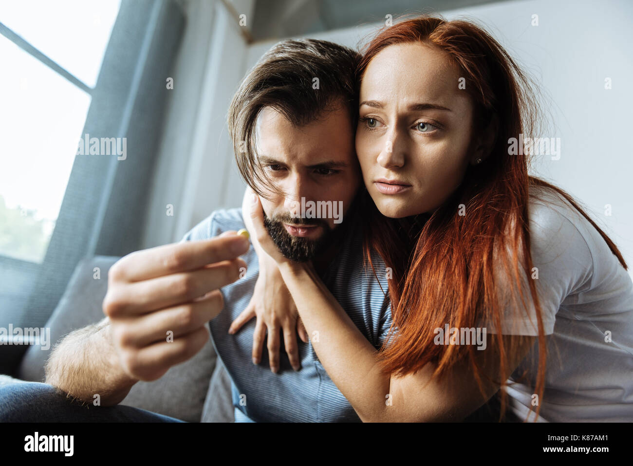 Pleasant young woman hugging her boyfriend Stock Photo - Alamy