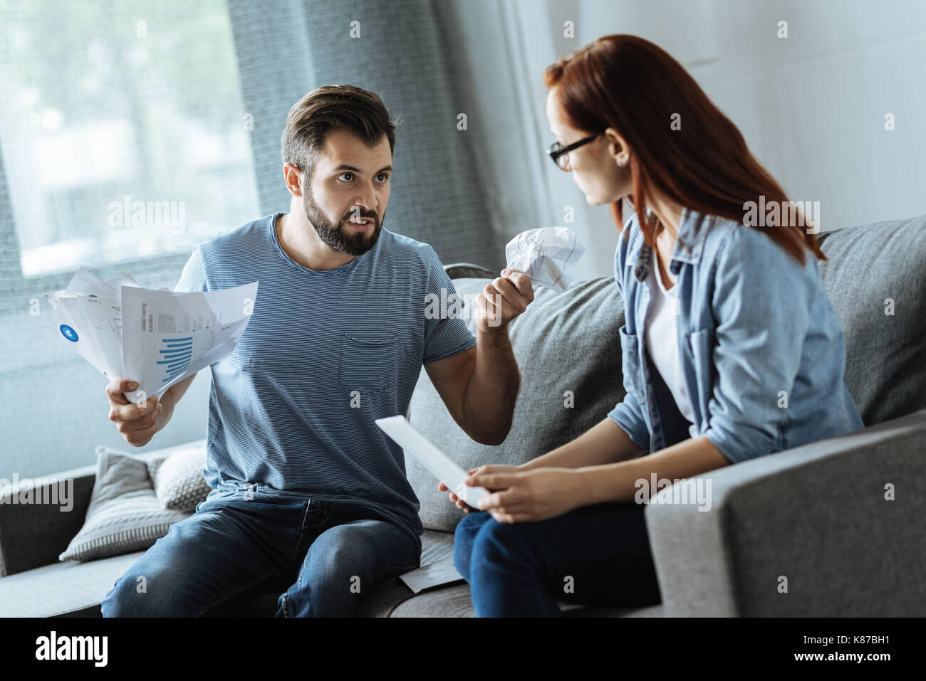 Unhappy brutal man being angry at his girlfriend Stock Photo