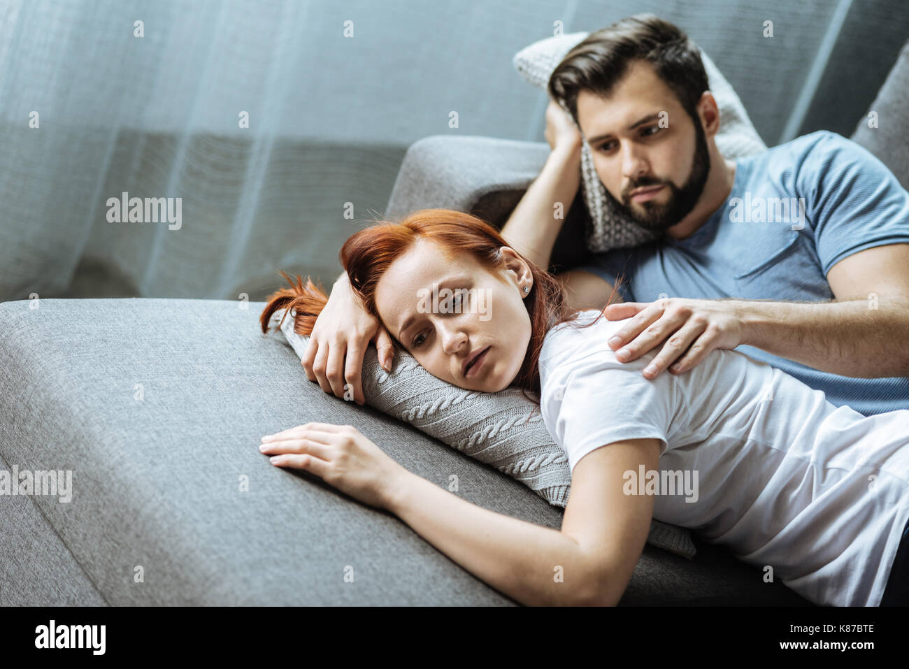 Handsome nice man holding his girlfriends shoulder Stock Photo