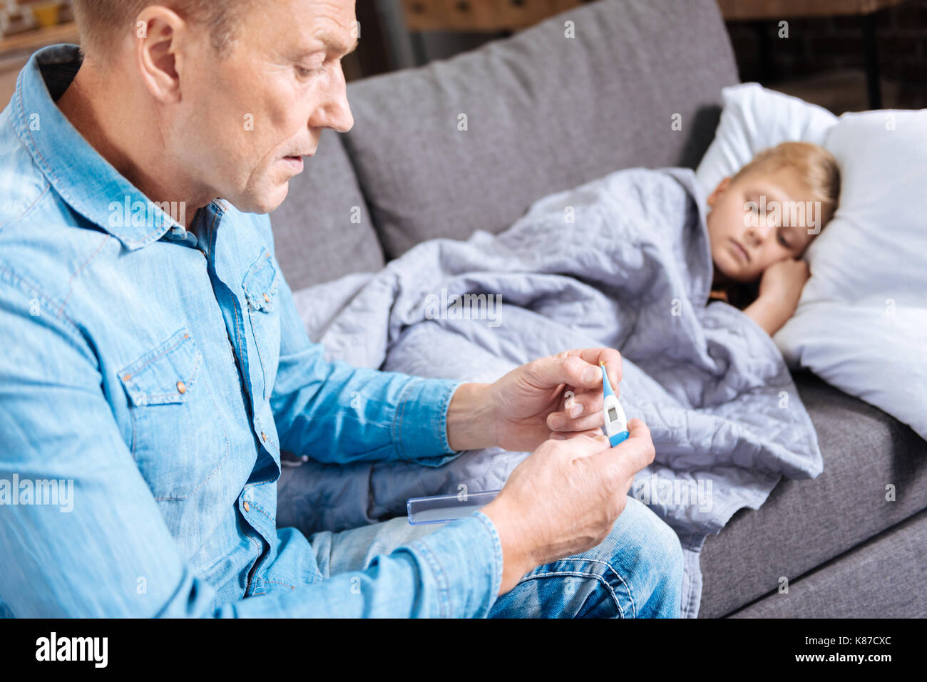 Worried parent sick child hires stock photography and images Alamy