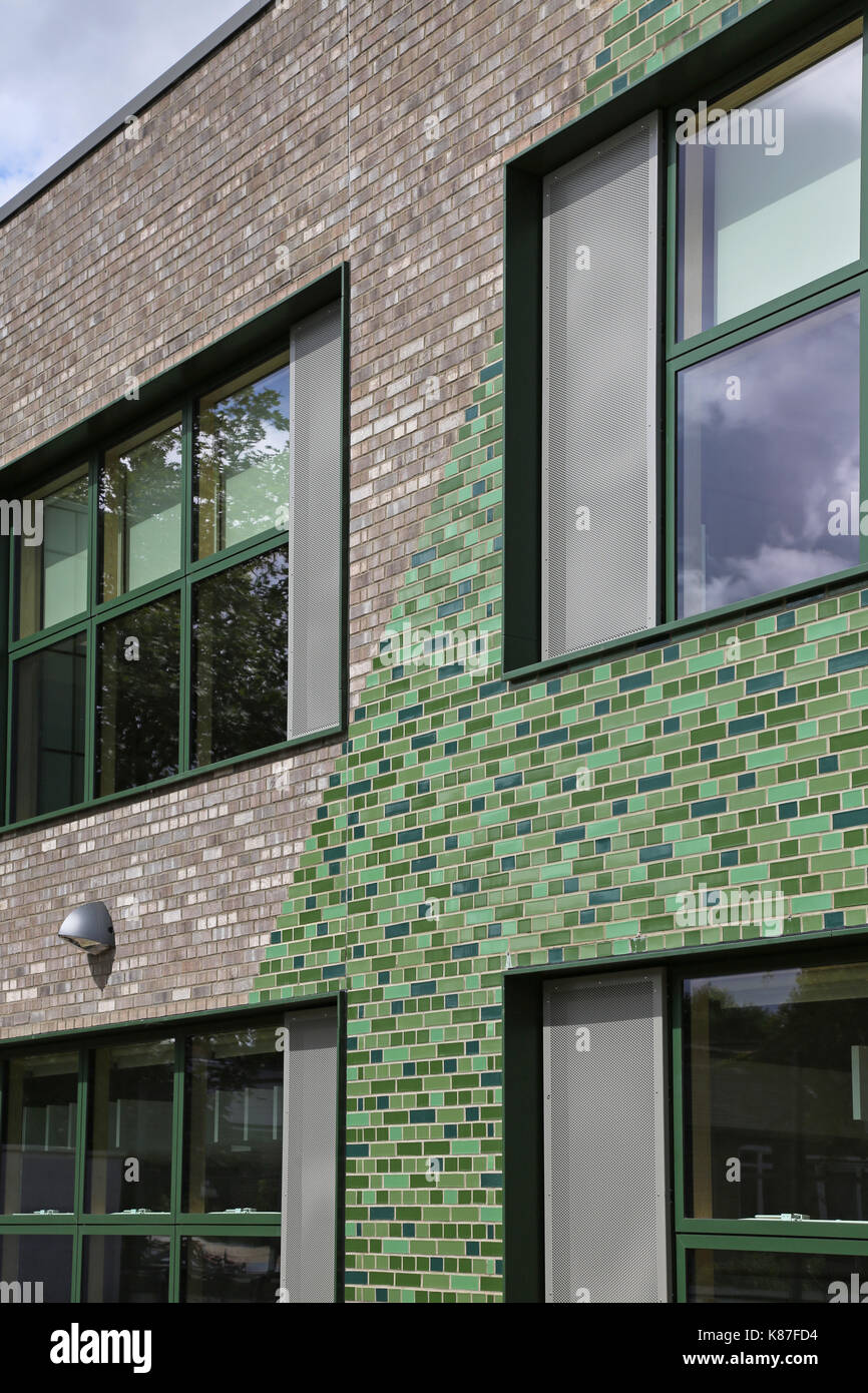 A new primary school in southeast London featuring glazed, green bricks in its external elevations. Stock Photo