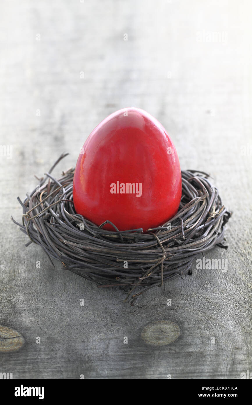 Red Easter egg in the nest Stock Photo