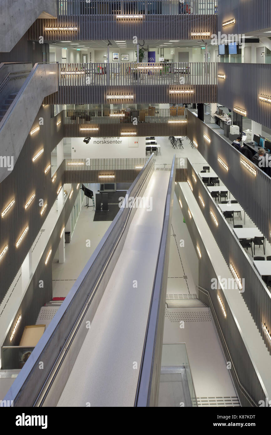 Descending suspended walkway across atrium. Krona Knowledge & Cultural Centre, Kongsberg, Norway. Architect: mecanoo + Code Arkitektur, 2015. Stock Photo