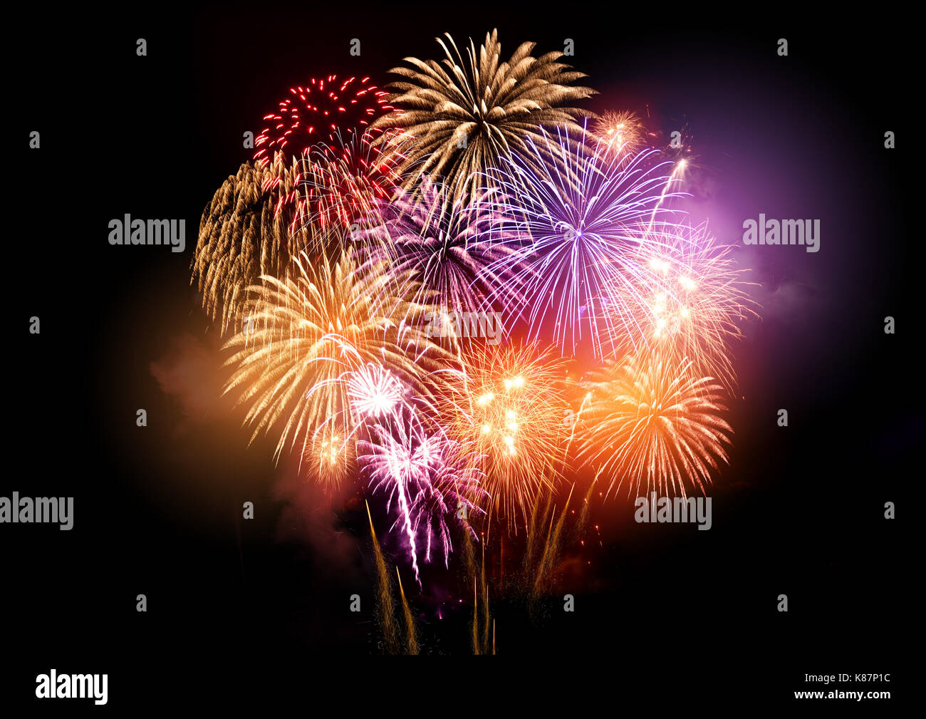 Bright and colourful fireworks display celebrations at night. Stock Photo