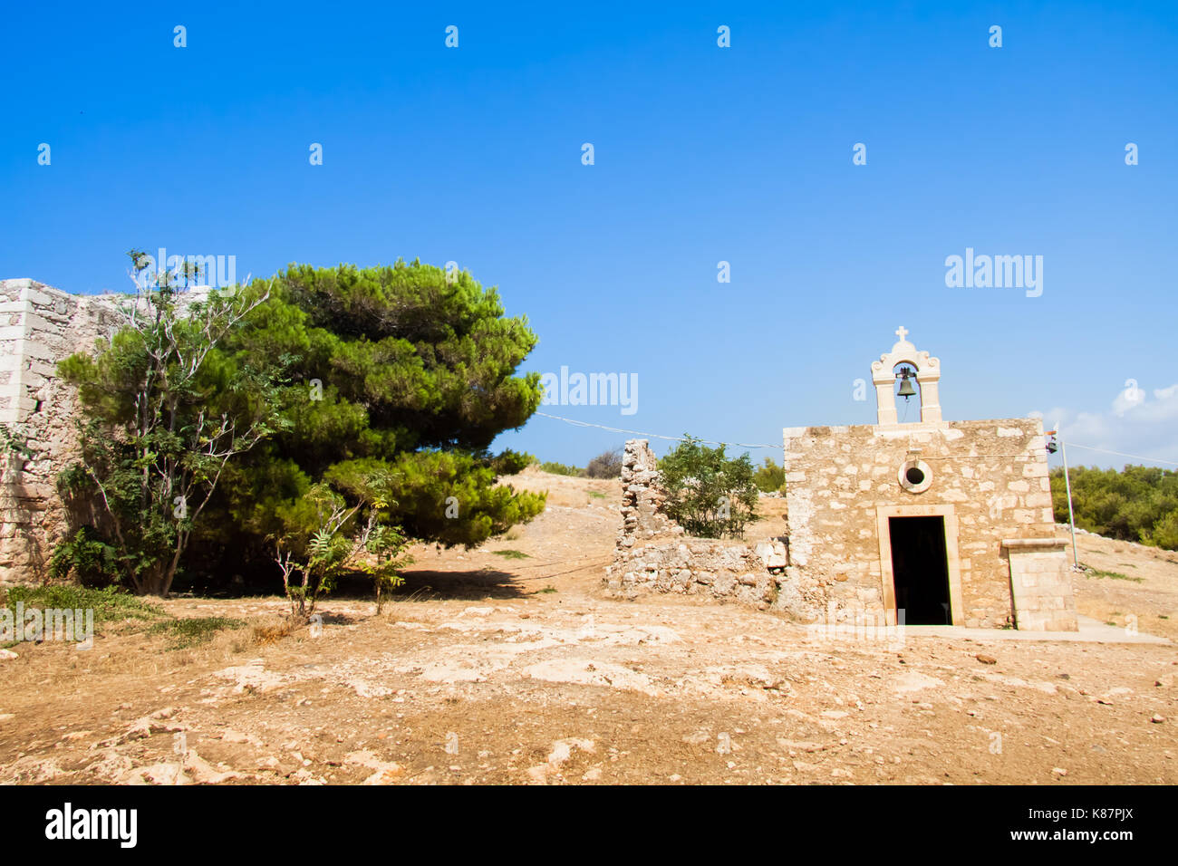 Orthodox church of St. Catherine (Agia Ekaterini) against the blue sky in the Fortress (Fortezza). Rethymno, Crete, Greece Stock Photo