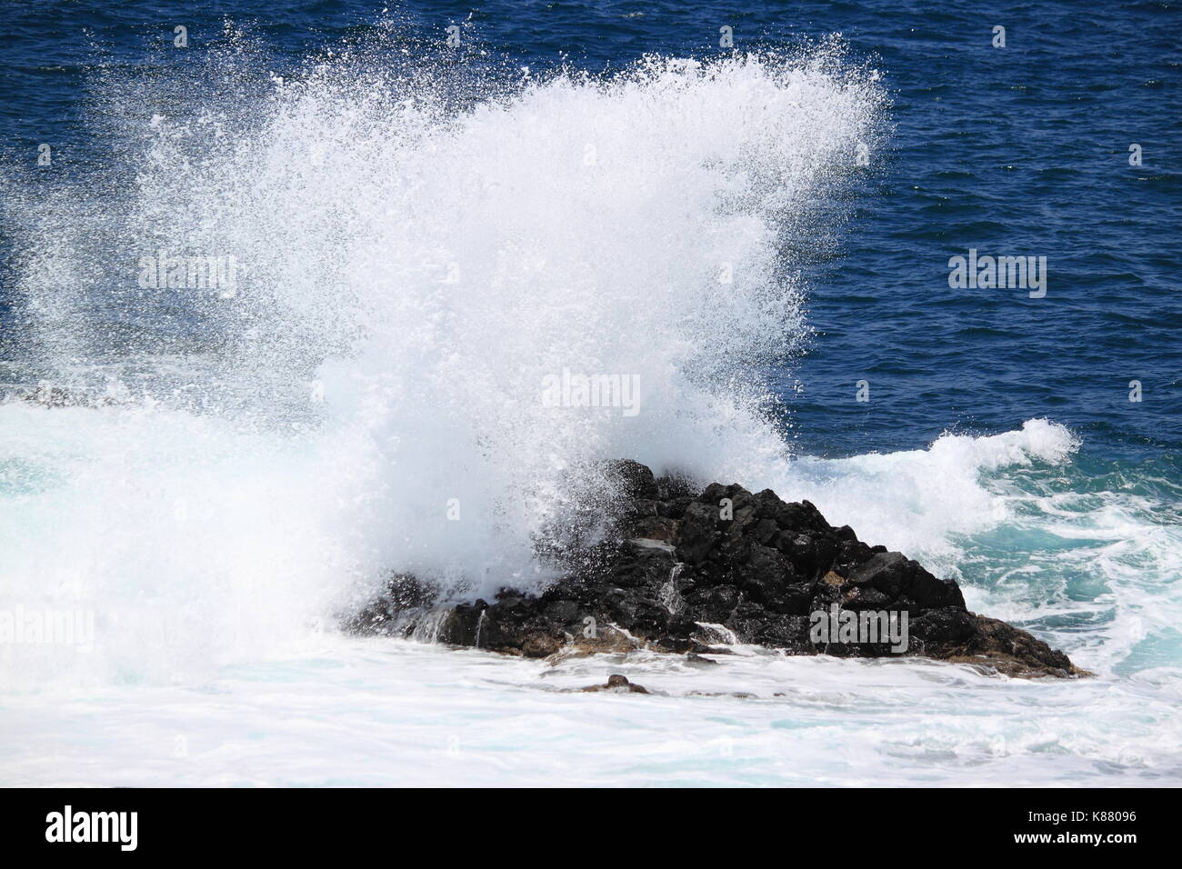Ocean waves crushing against a cliff Stock Photo Alamy