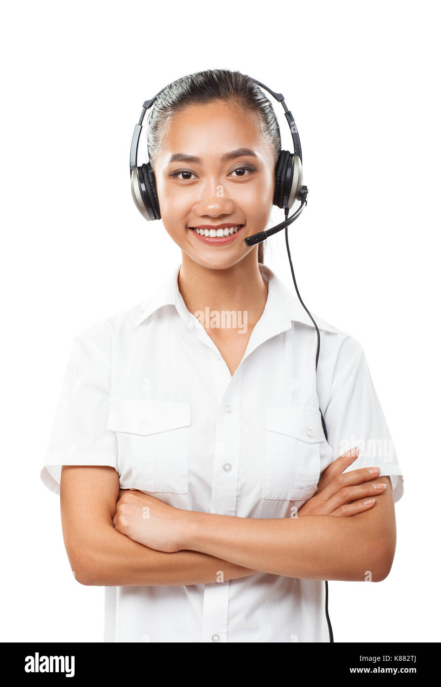 Beautiful Asian business woman with headset. Female operator call center, helpdesk or customer support hotline. Half body vertical portrait of young f Stock Photo