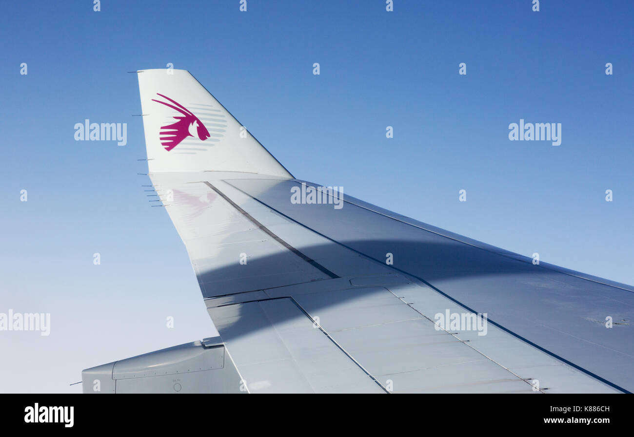 Qatar Airways logo on the wingtip of an A330 Qatar Airways plane Stock Photo