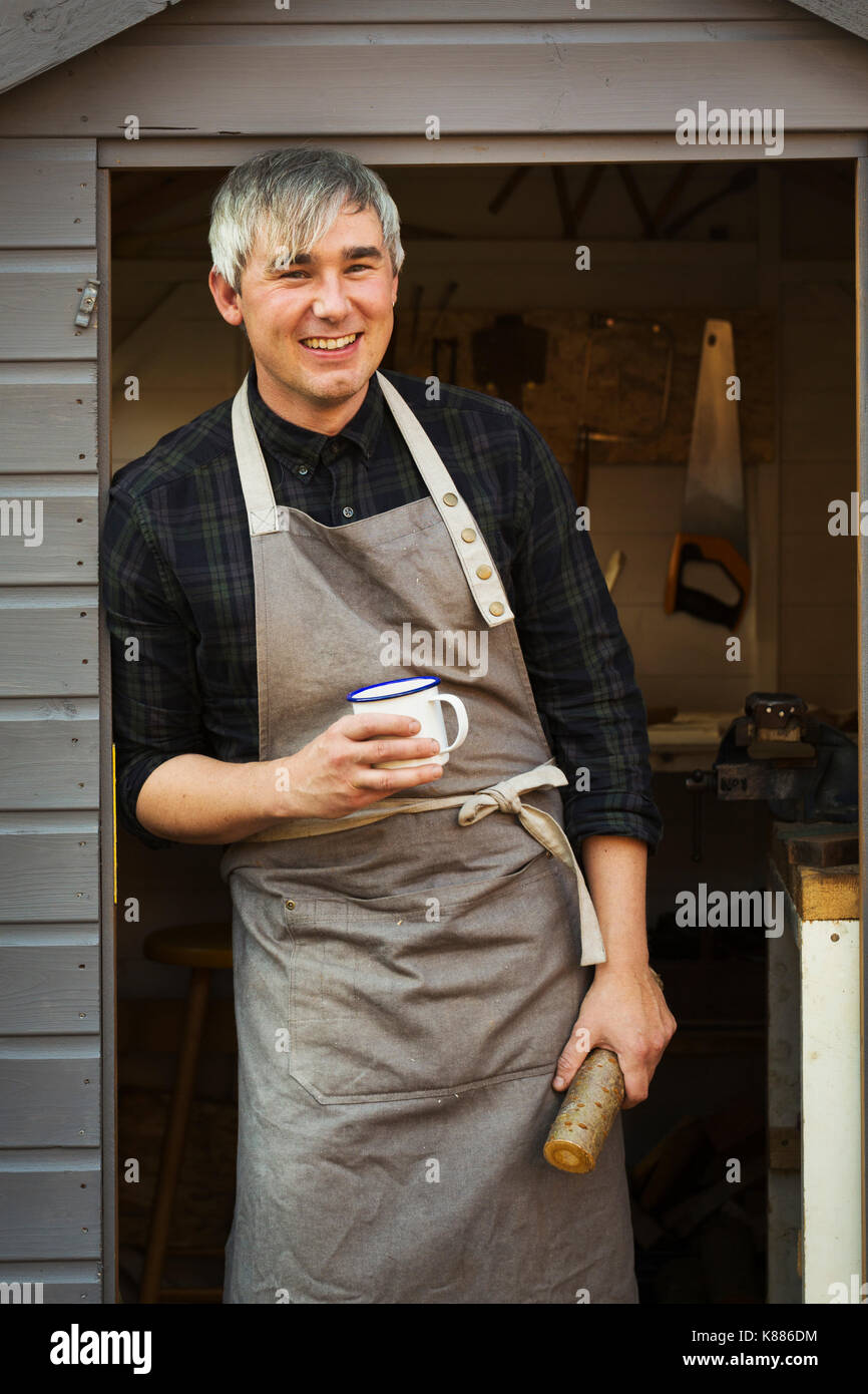 Craftsman in apron standing hi-res stock photography and images - Alamy