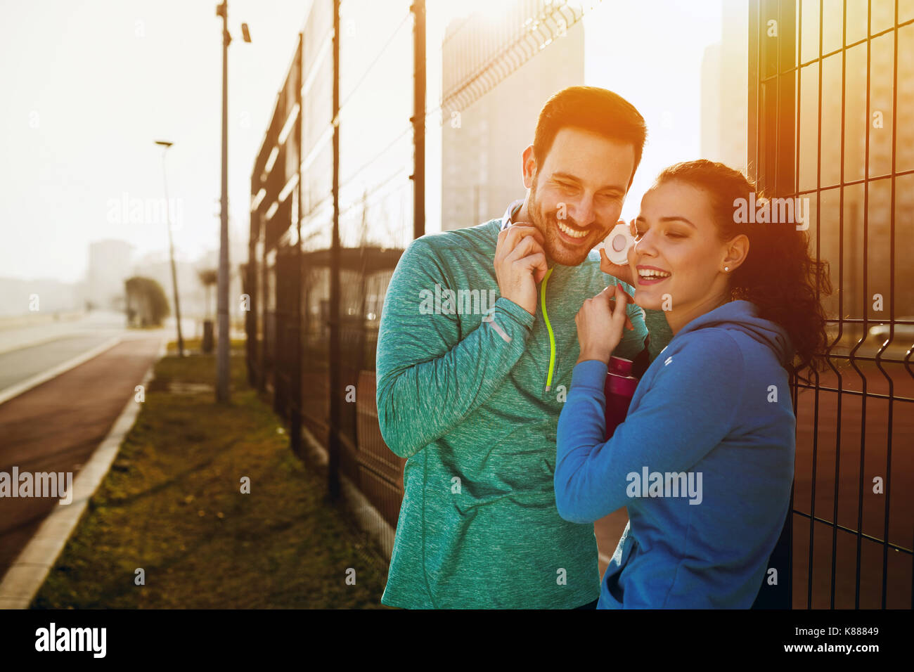 Sportsman and sportswoman flirting outdoor after fitness exercis Stock Photo