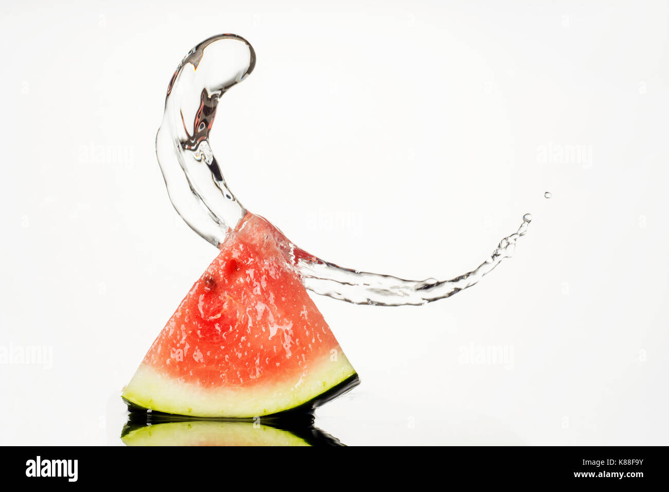 Watermelon With Water Splash isolated on white background Stock Photo