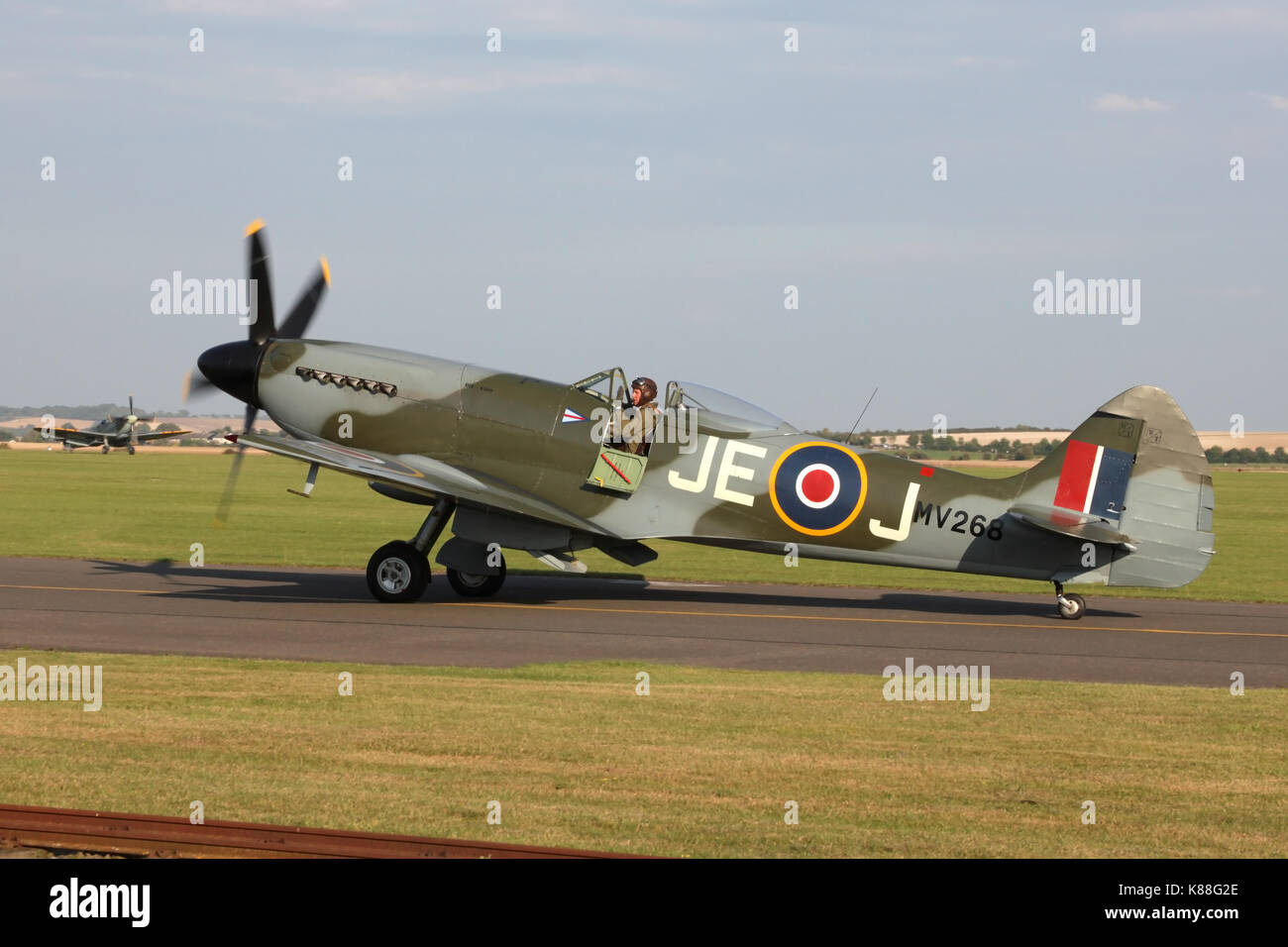 The Fighter Collection's Mk XIV Spitfire taxiing in at Duxford after one of the historic airfields many flying displays. Stock Photo