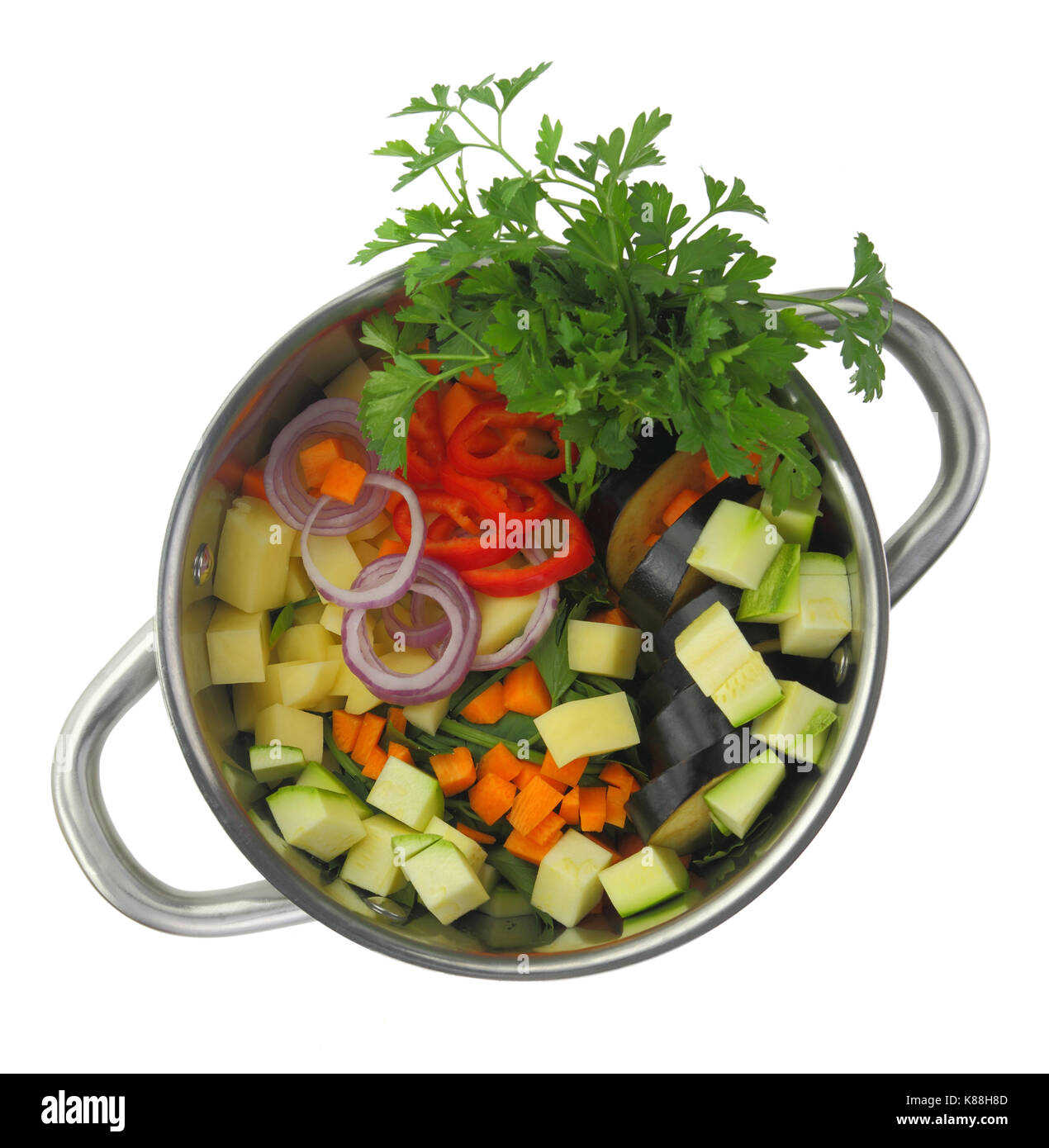 Fresh cut ingredients for vegetable soup in a pot Stock Photo