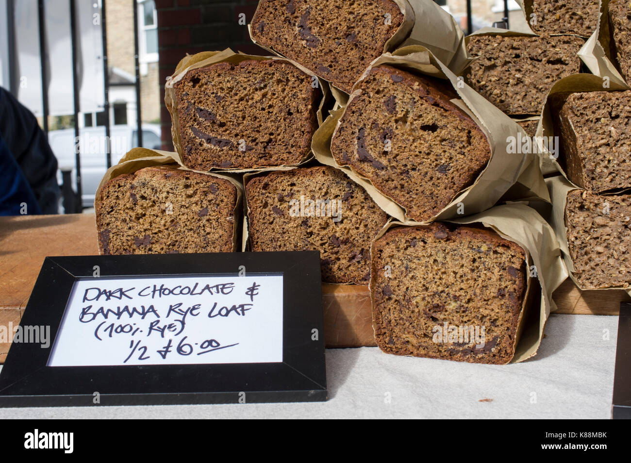 Dark chocolate and banana rye loaf breads in an outdoor market in London Stock Photo
