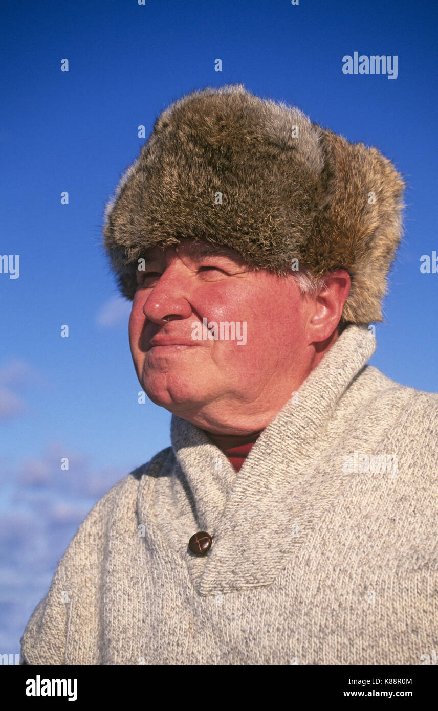 A ruddy-faced farmer on his small Dacha, on the banks of the Volga river in remote western rural Russia. Stock Photo