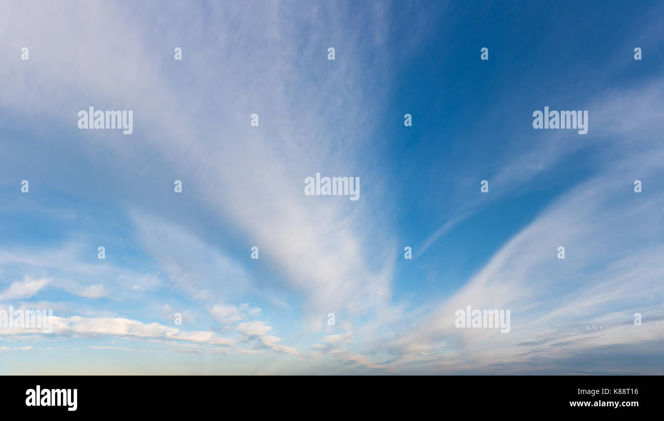Fantastic white clouds against blue sky Stock Photo - Alamy
