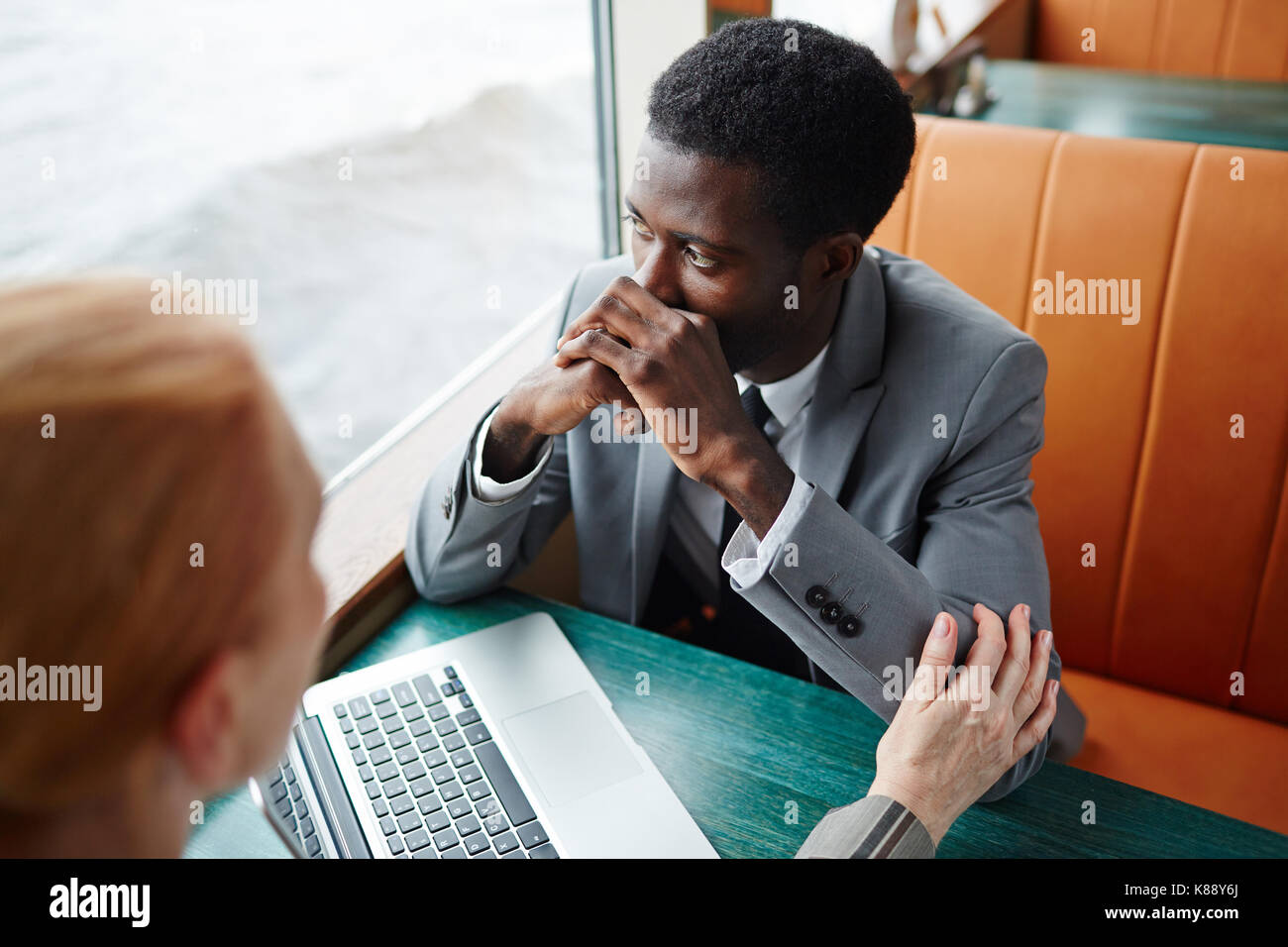 Businesswoman reassuring her stressed colleague during business travel Stock Photo