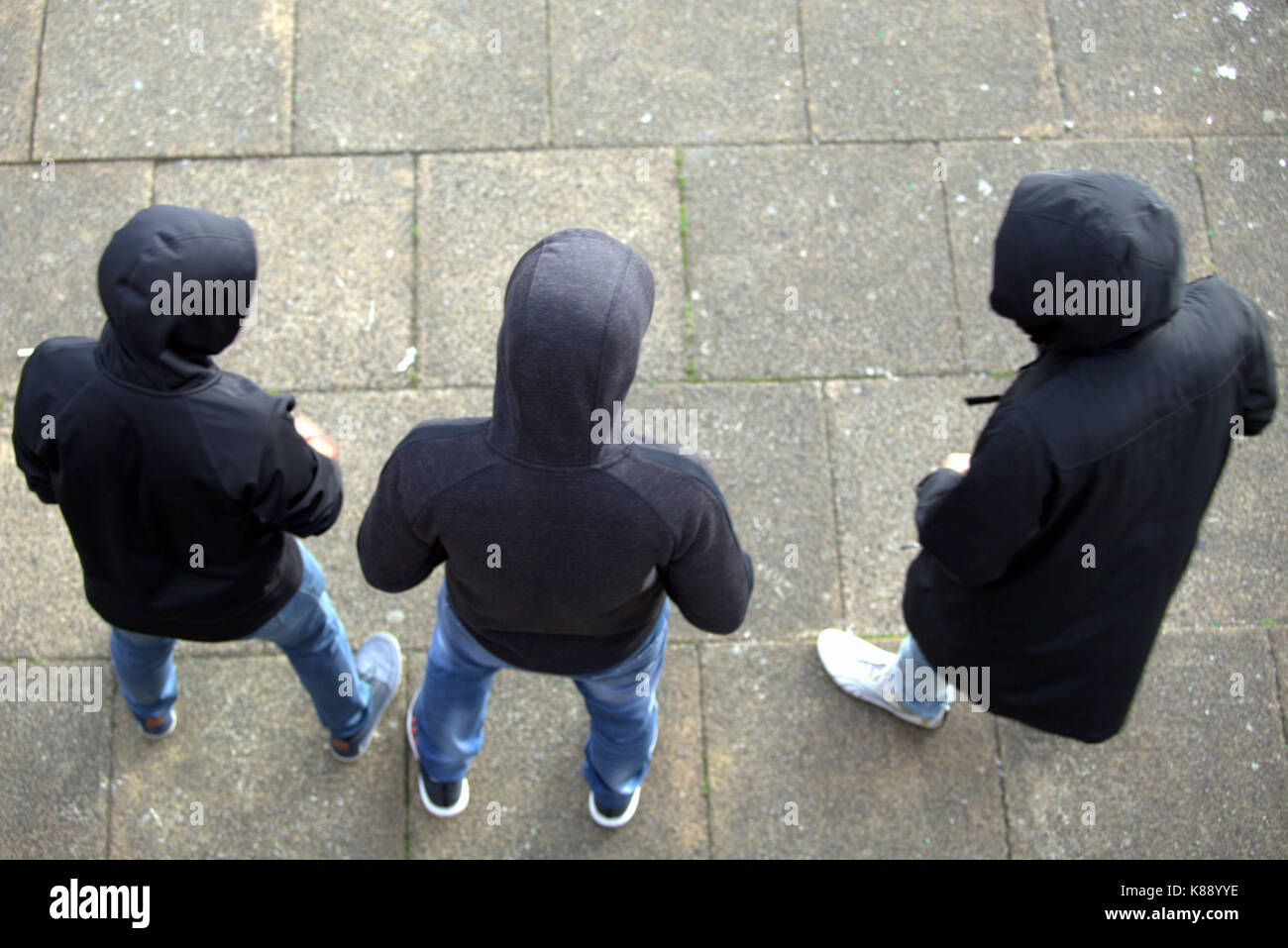 young boys viewed from above hoodies hooded posing for selfies Stock Photo