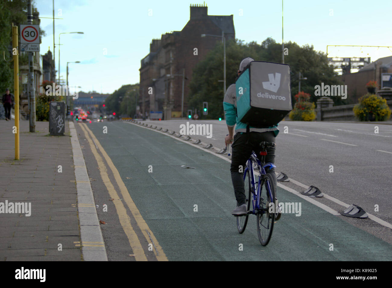 deliveroo bike delivery cyclist on the street in Glasgow Stock Photo