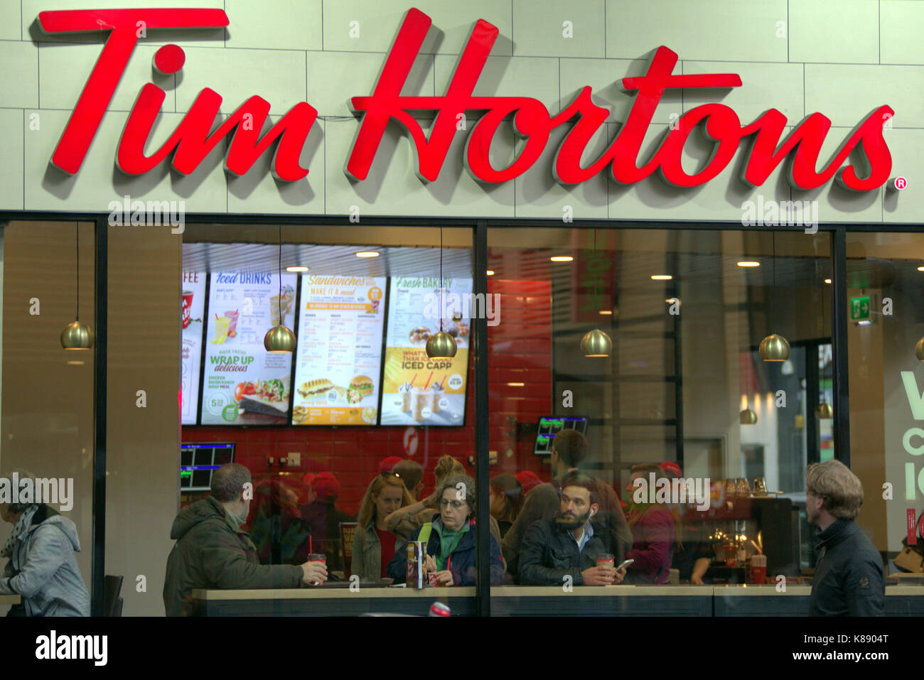 Tim Hortons donut Canadian multinational fast food restaurant known for its coffee and donuts shop coffee bar the first in the UK om Glasgow Stock Photo