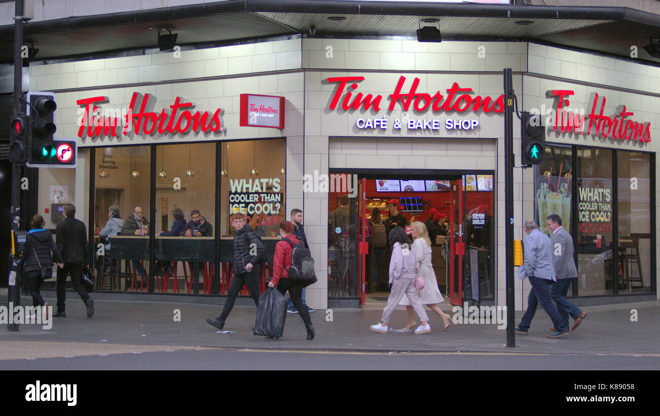 Tim Hortons donut Canadian multinational fast food restaurant known for its coffee and donuts shop coffee bar the first in the UK om Glasgow Stock Photo
