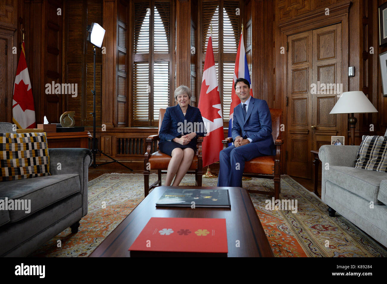Prime Minister Theresa May talking with Canadian Prime Minister Justin Trudeau in Ottowa. Stock Photo