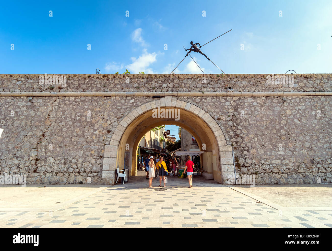 Antibes, France - July 01, 2016: Modern art sculptures on the Pre-des-Pecheurs esplanade and historic wall in old town. The area was renovated in 2014 Stock Photo