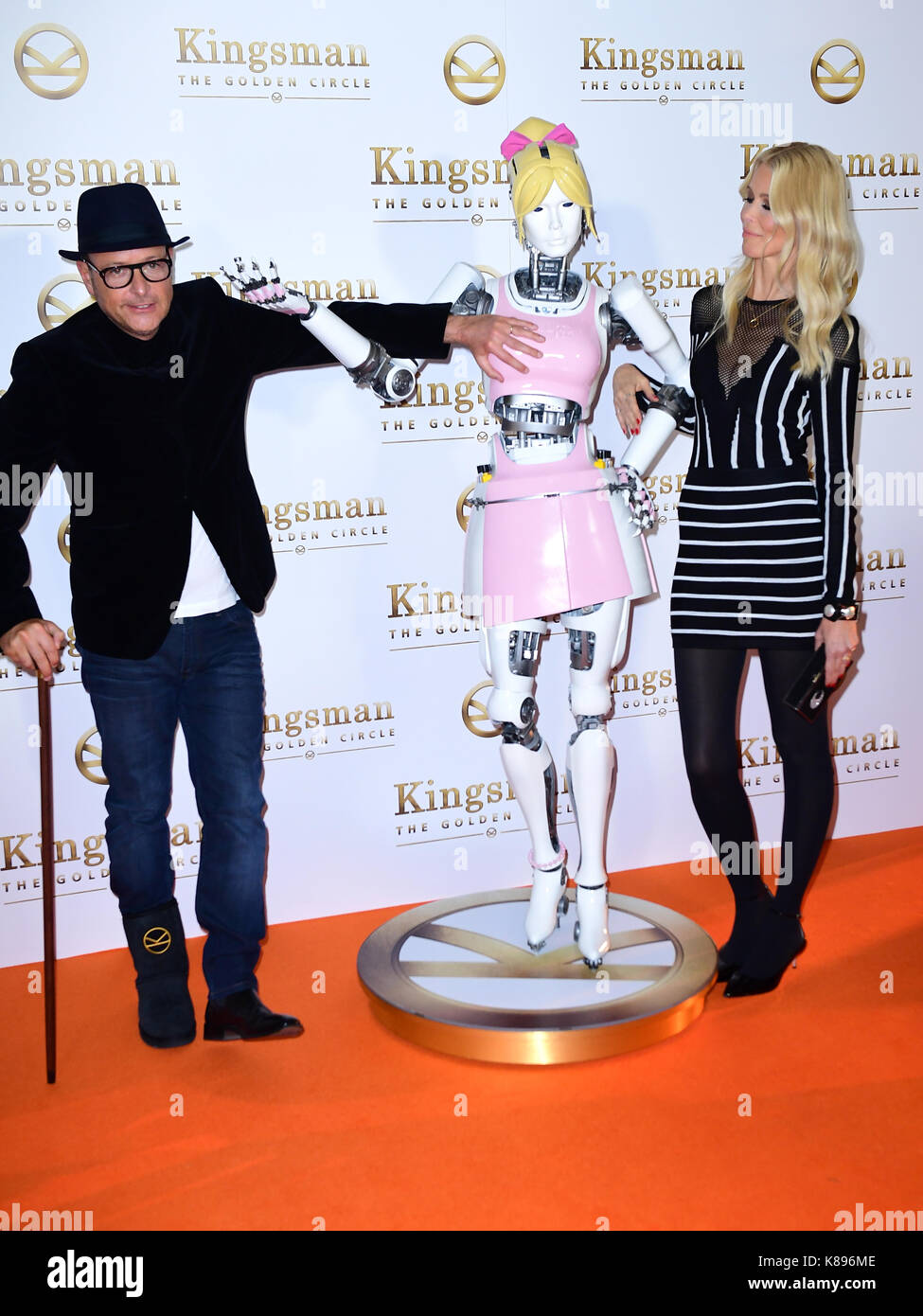 Matthew Vaughn, a robot, and Claudia Schiffer attending the World