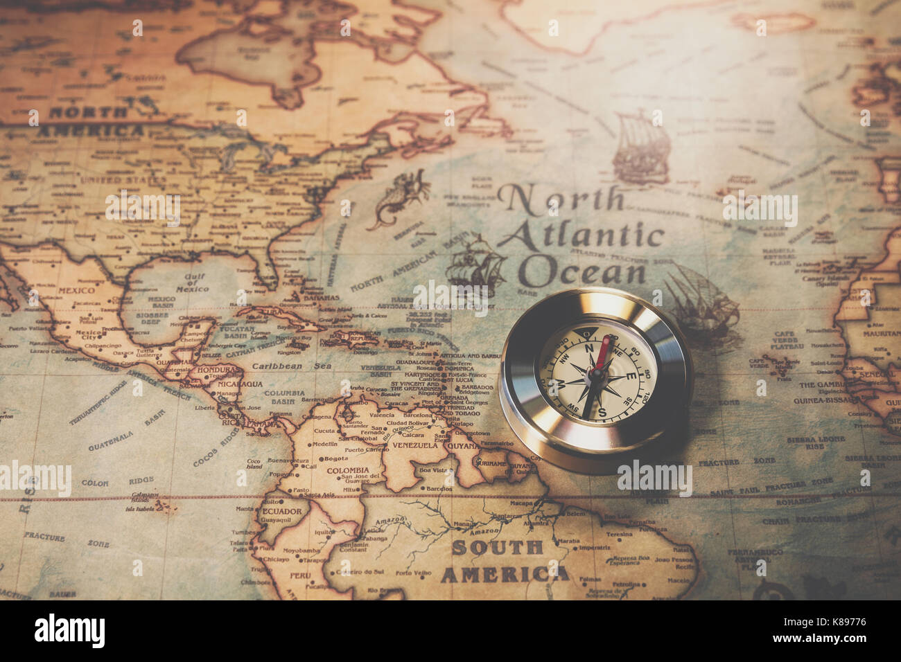 Columbus day and world map with compass Stock Photo - Alamy
