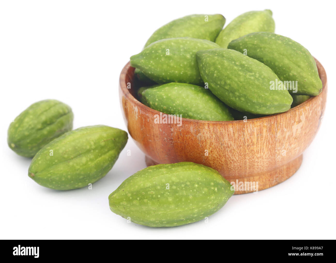 Fresh green medicinal haritaki fruits over white background Stock Photo