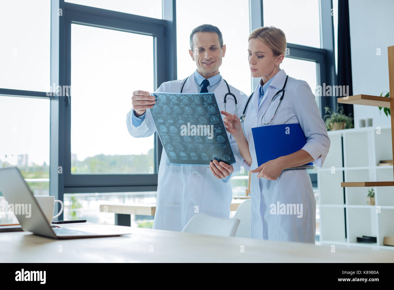 Pleasant smart colleagues working together Stock Photo