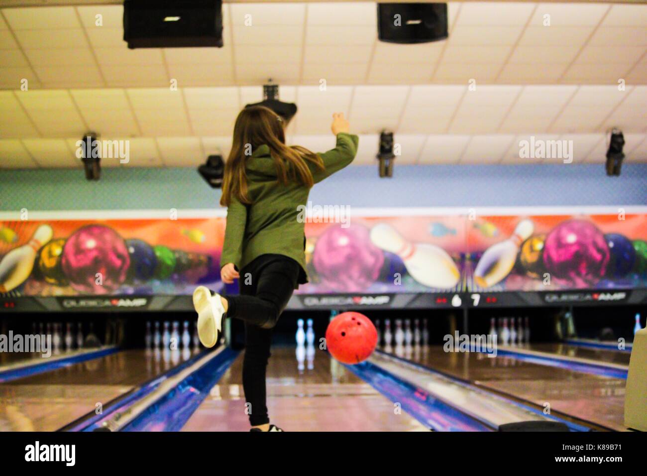 Candid Child Bowling Action Shot Stock Photo