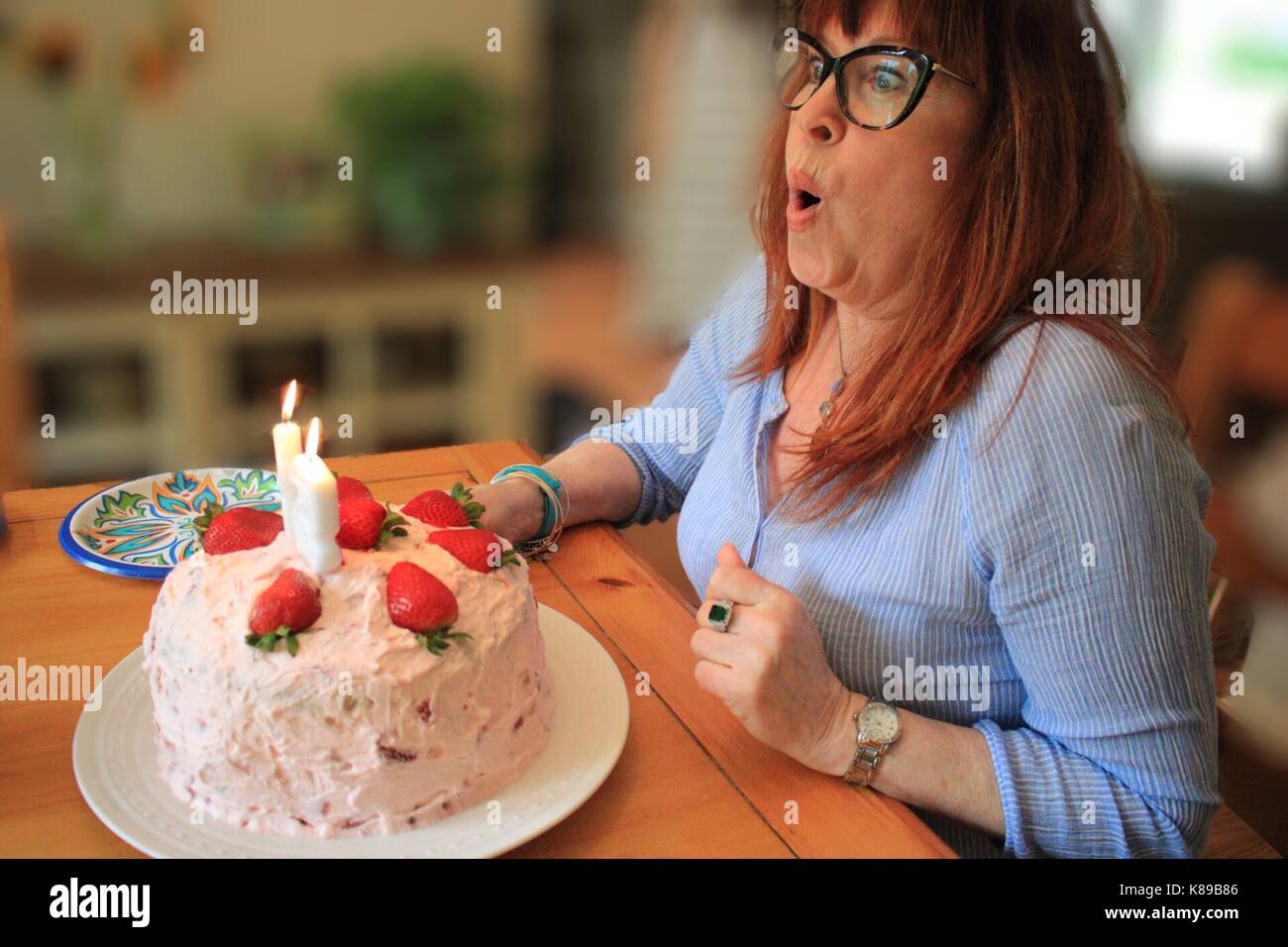 Candid Birthday Candles blowing out Stock Photo